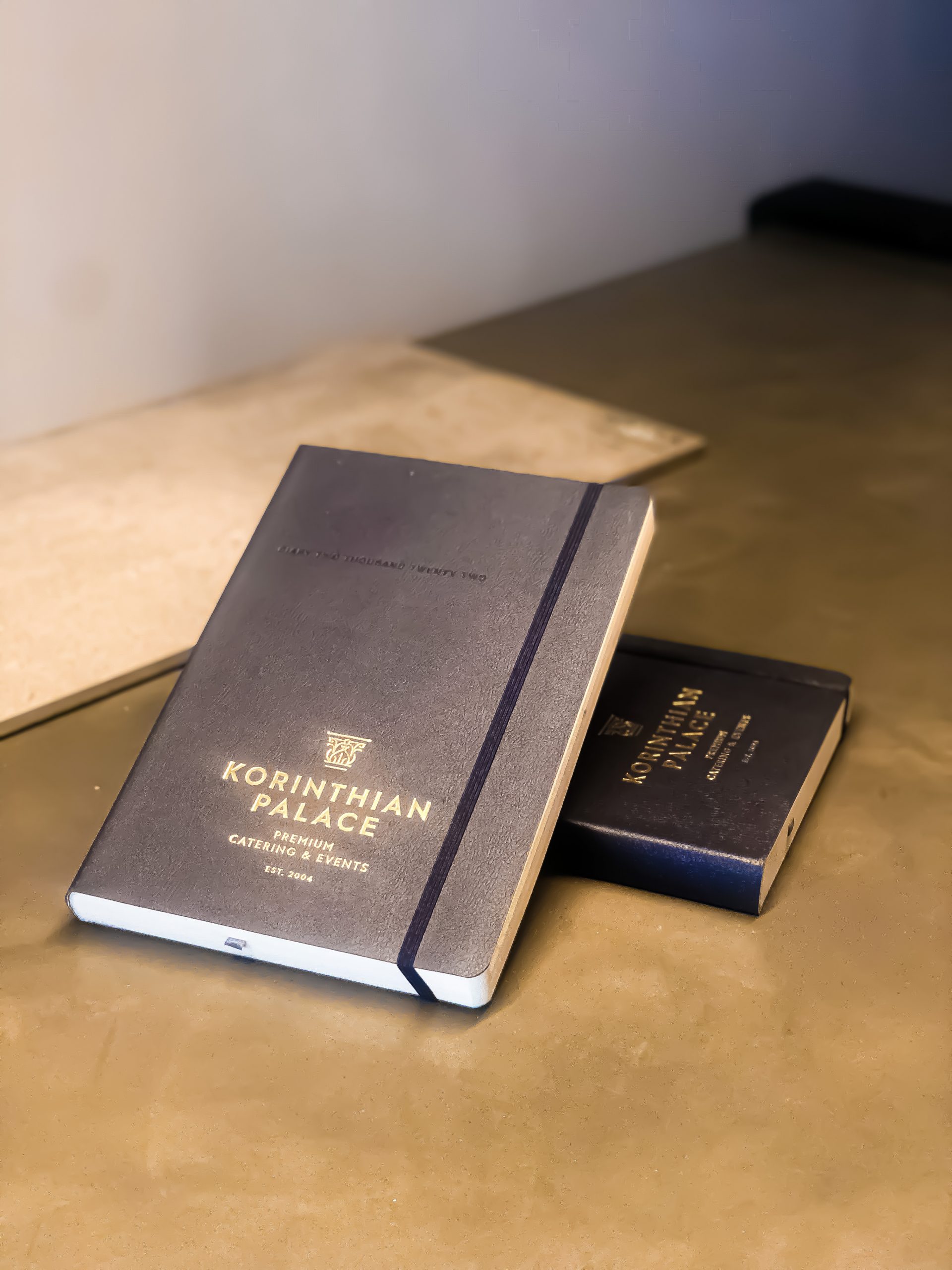 Korinthian Palace notebook and business card