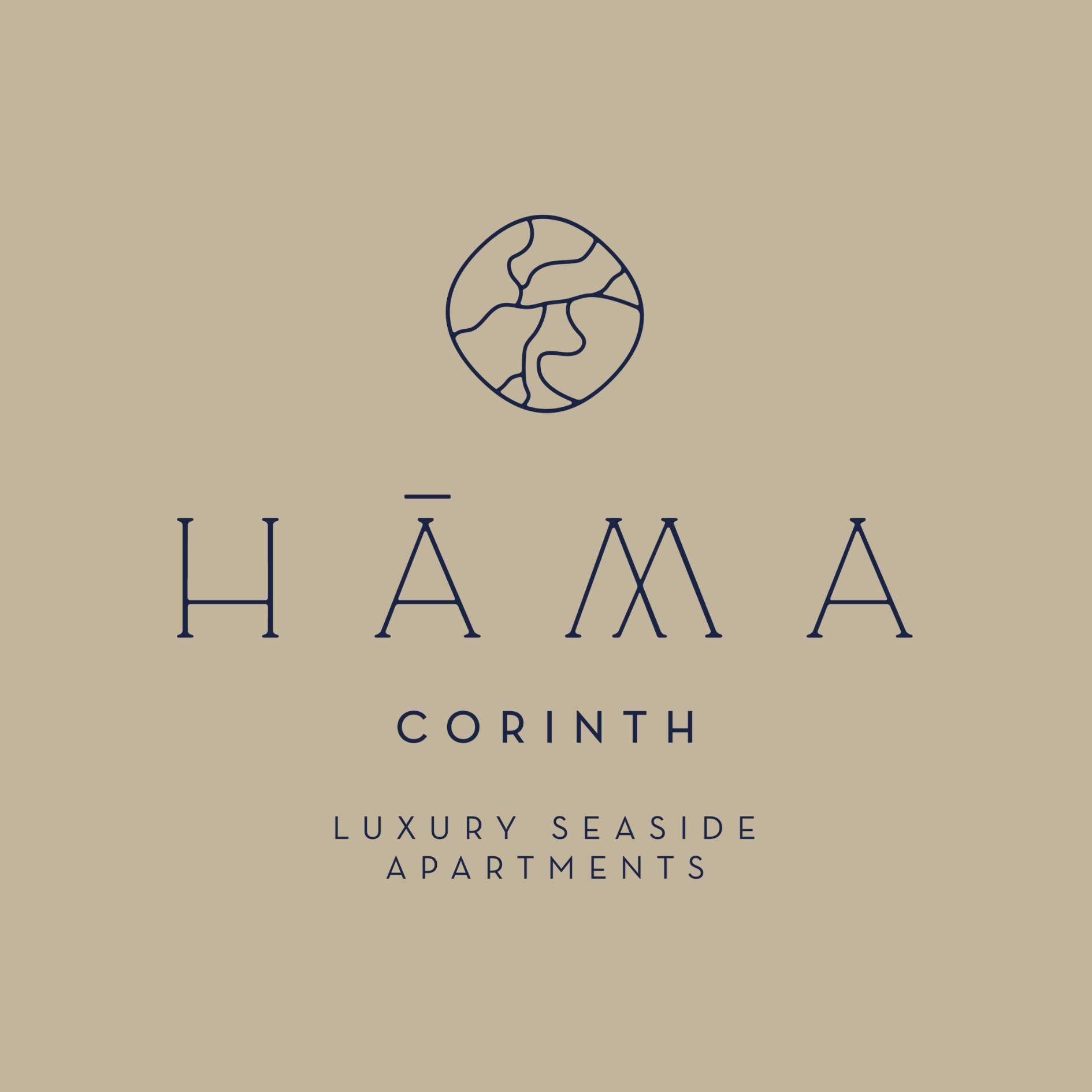 Το λογότυπο Hama Corinth πάνω σε άμμο