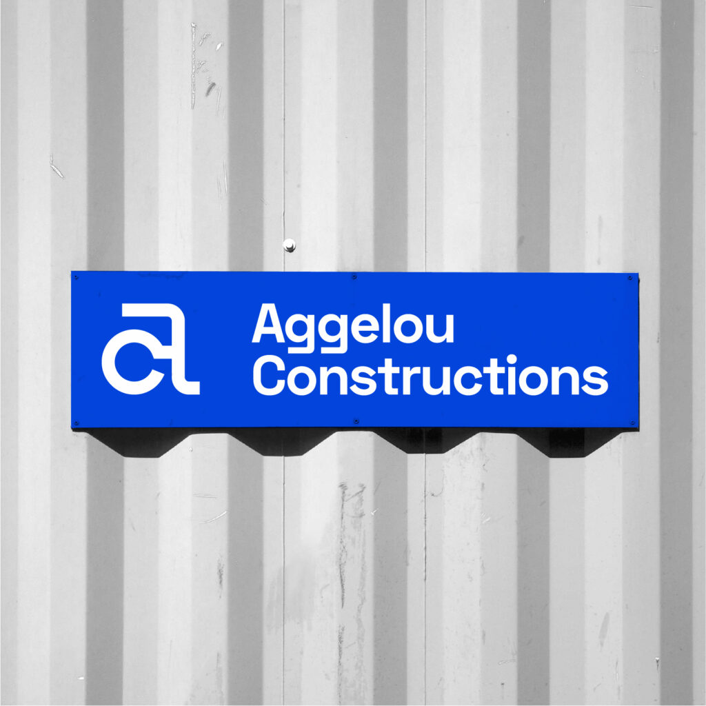 Blue Aggelou Constructions sign with the AC symbol