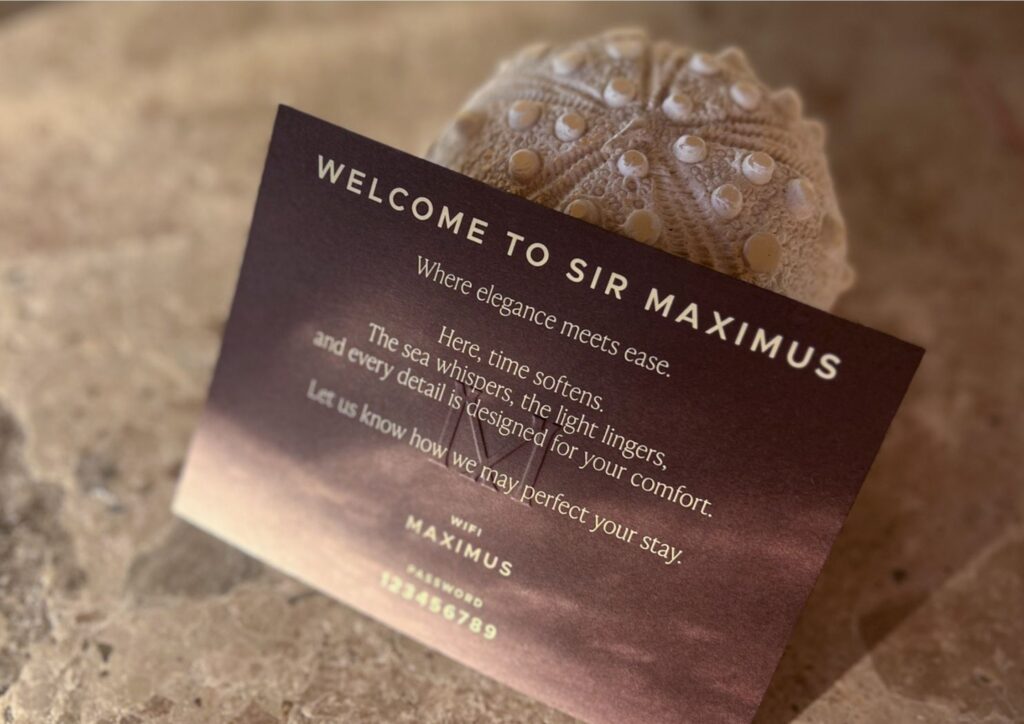 Welcome card reading ‘Welcome to Sir Maximus’, on stone