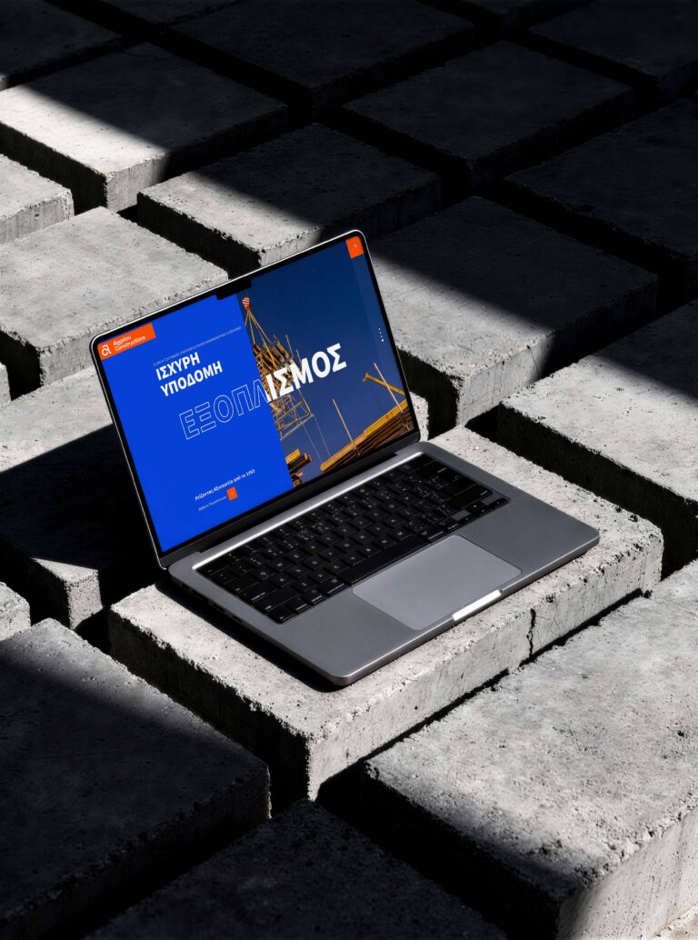Aggelou Constructions website by VIMA GURU on a laptop